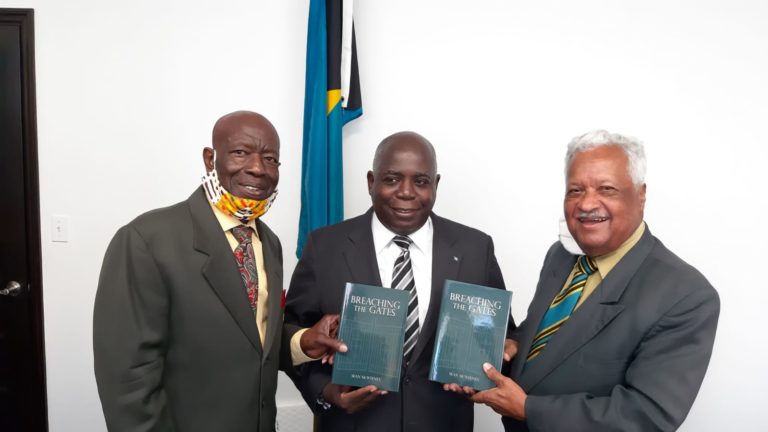 Evangelist Rex Major presents book to Opposition leader
