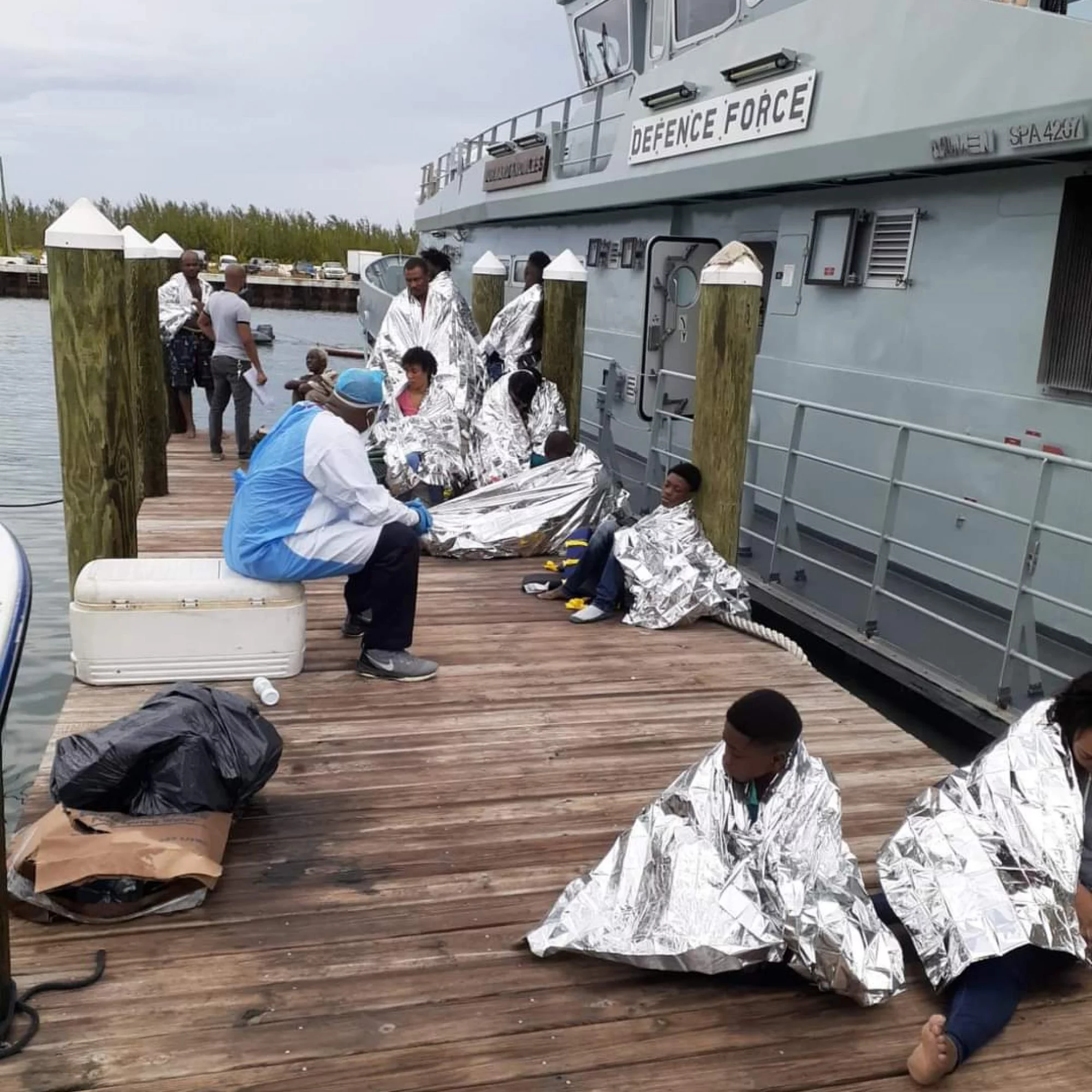 12 migrants rescued at sea, search continues for others
