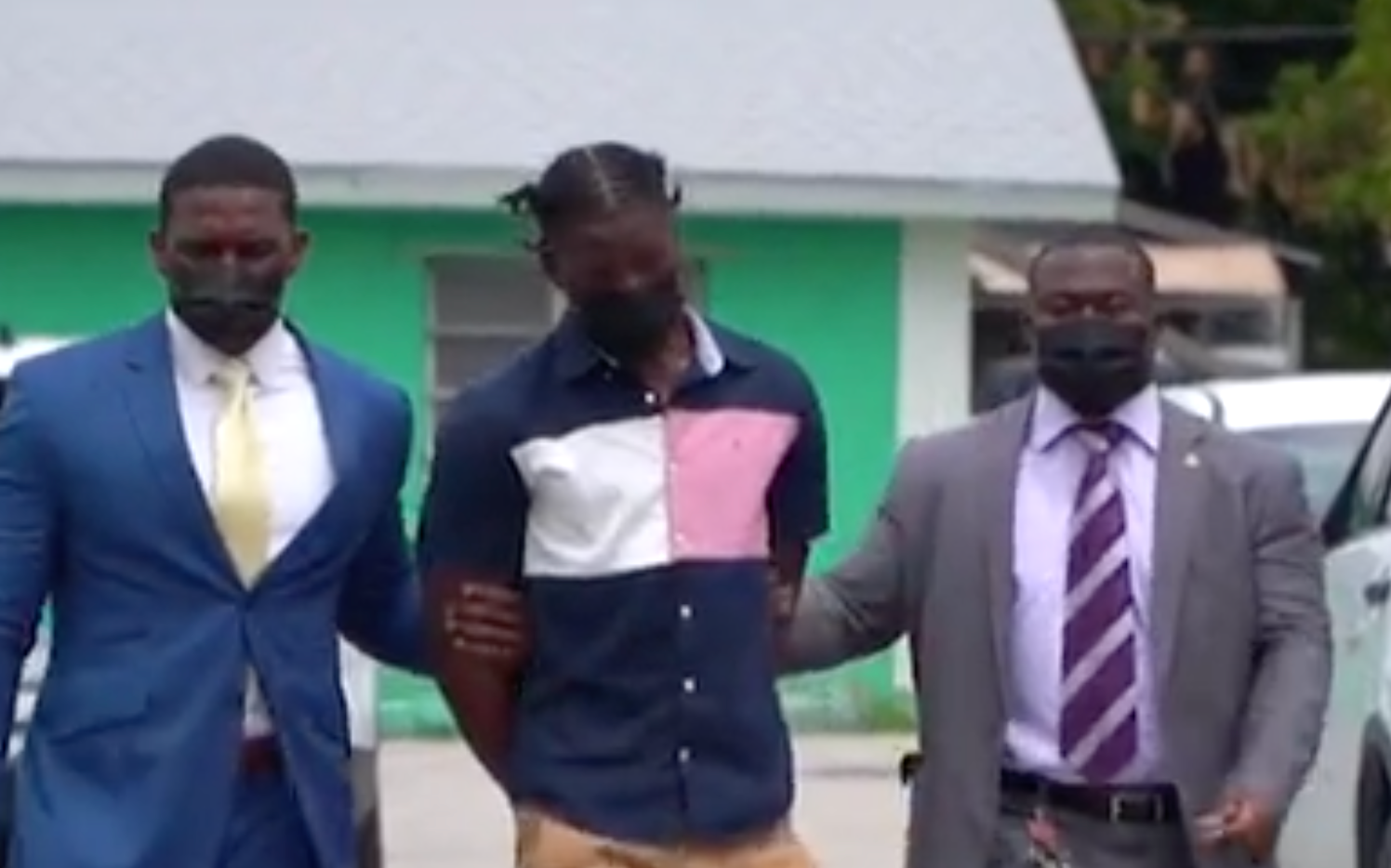 CHAOS AT COURT AS SIX MEN ARE CHARGED WITH MURDER