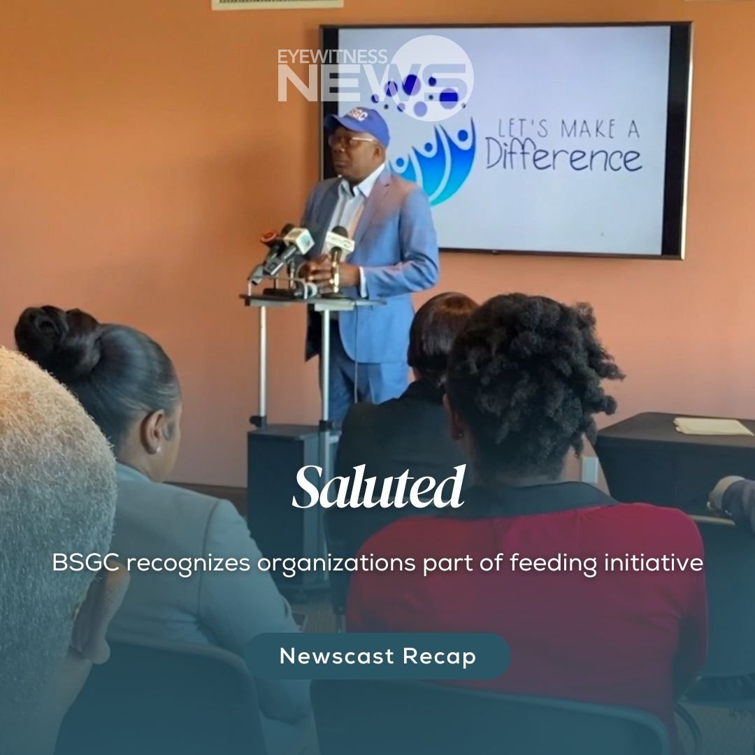 Straw market vendor admires her straw work