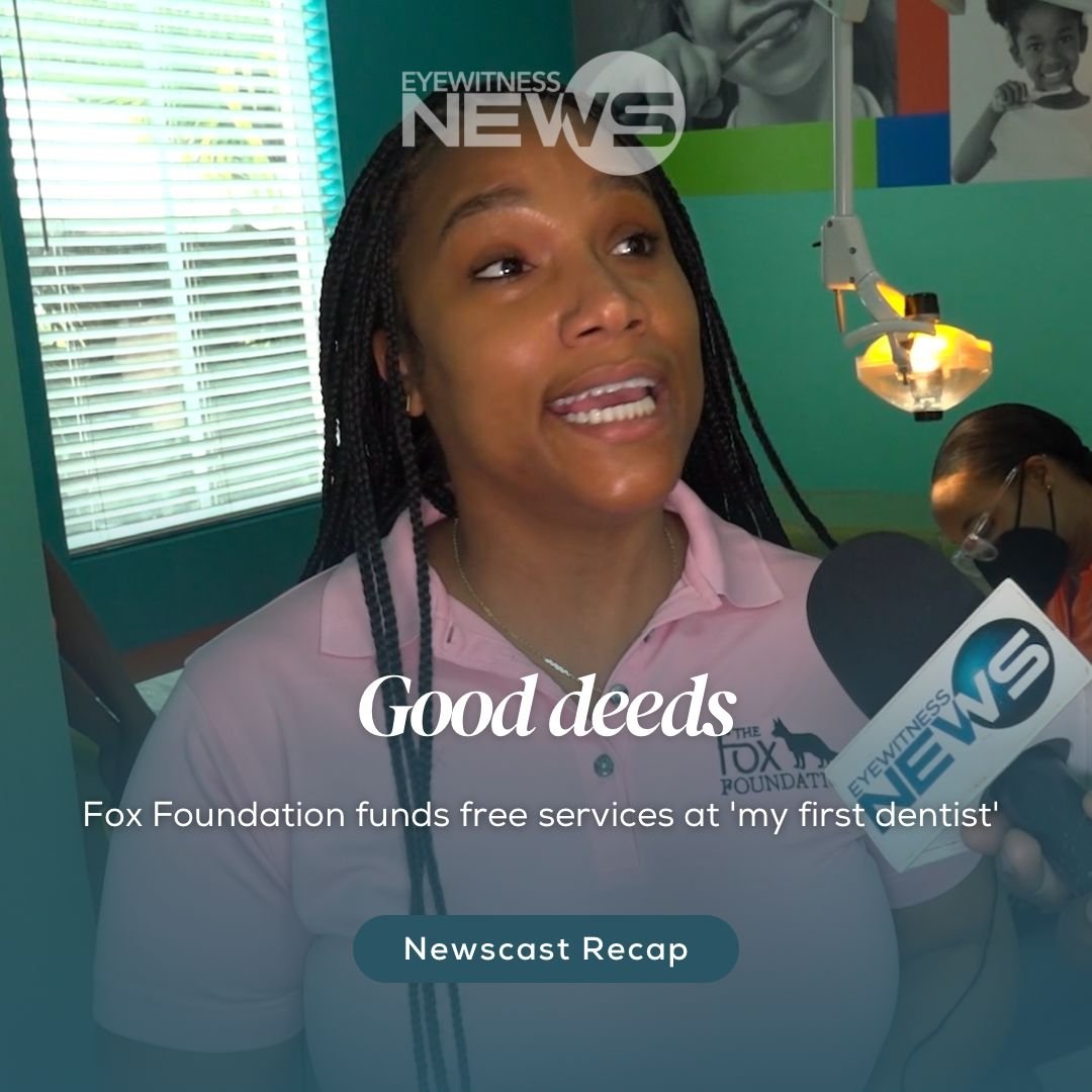 Straw market vendor admires her straw work